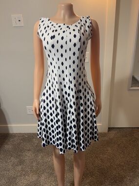 Sleeveless White and Navy Polka Dot Fit-and-Flare Dress